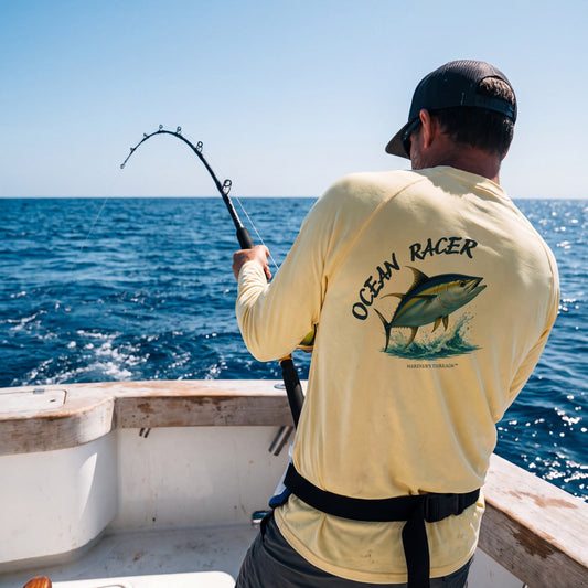 Ocean Racer performance shirt in yellow, fighting a fish offshore
