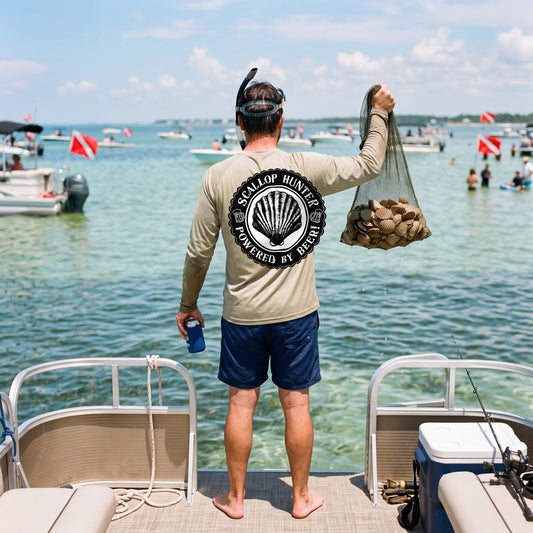 Scallop Hunter performance shirt, holding up a full bag of bay scallops